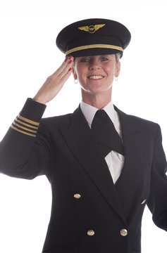 Senior airline pilot in uniform saluting American style salute