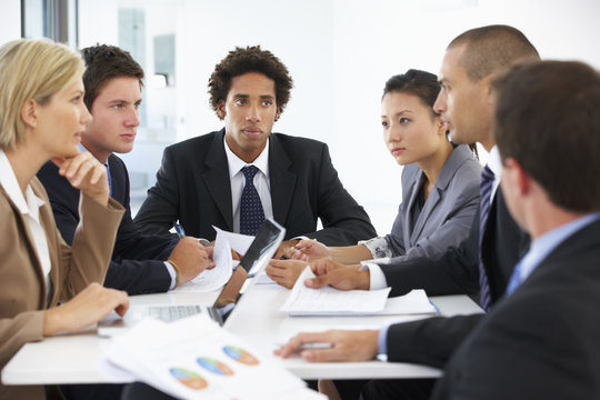 Group Of Business People Having Meeting In Office