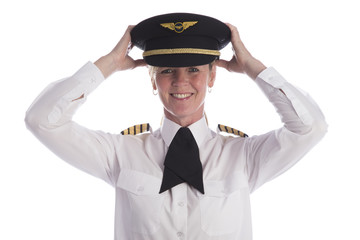 Female pilot in uniform and wearing her hat
