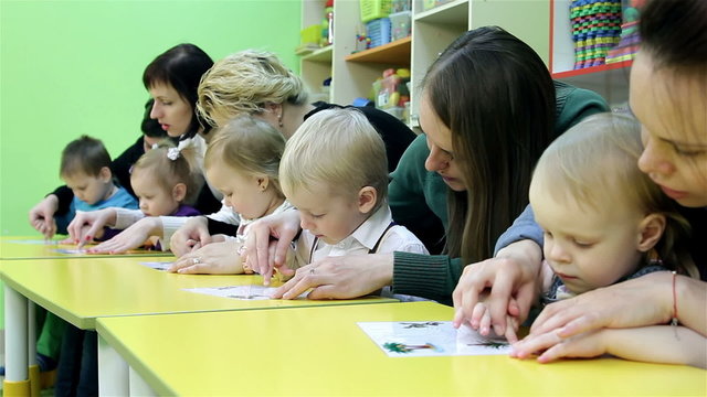 Small children and their mothers engaged in the development of intelligence
