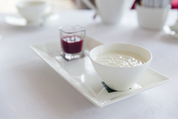 close up of yogurt and jam at restaurant