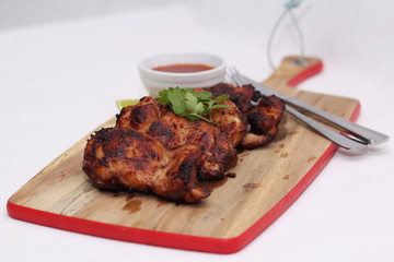 Grilled spicy chicken thighs with lime and sweet chilli sauce