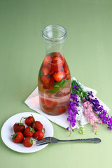 Cocktail with fresh strawberries and mint