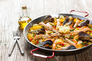 Paella with mussels and shrimps - obrazy, fototapety, plakaty