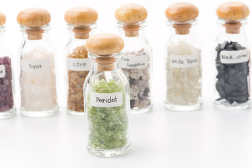 peridot in glass bottle