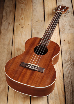 hawaiian ukulele on wooden floor