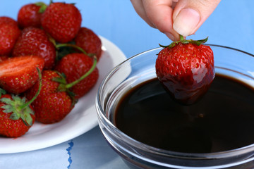 chef making chocolate dipped strawberries