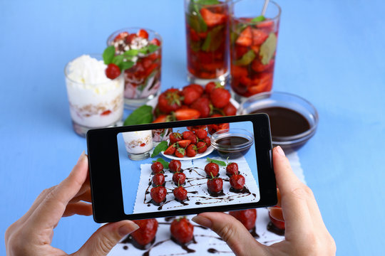Photographs of strawberry desserts phone. Strawberries with chocolate.