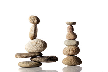 Fototapeta na wymiar Balanced stacks of different river stones
