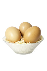 Brown eggs in sawdust