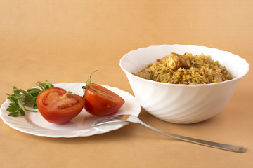 Pilaf and tomatoes