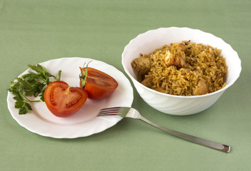 Pilaf and tomatoes