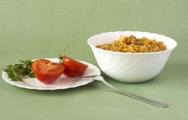 Pilaf and tomatoes