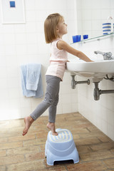 Girl In Bathroom Brushing Teeth