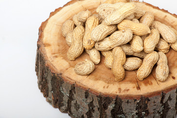Pile of unshelled peanuts, isolated on white background