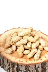 Pile of unshelled peanuts, isolated on white background