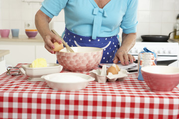 Senior Woman Baking In Kitchen