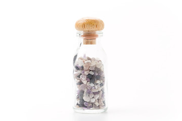 pink sapphire in glass bottle