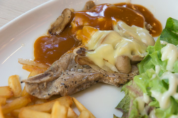 pork chop steak with cheese and black pepper mushroom gravy