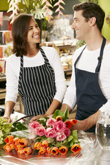 Portrait Of Two Sales Assistants In Florists Shop