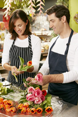 Portrait Of Two Sales Assistants In Florists Shop