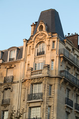 Fototapeta na wymiar corner of of typical house with balcony in Paris, France