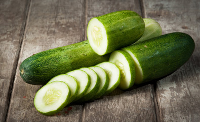 cucumber slices on wooden background