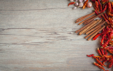 Dried chilies and spices on a wood