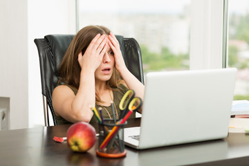 Beautiful woman working at the computer