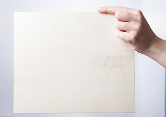 Obraz premium hand holding blank paper isolated on white background