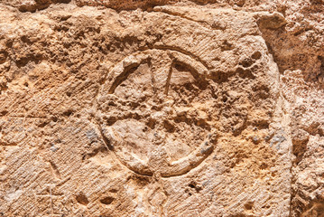Christian cross of stone  wall of the Church of the Holy Sepulchre