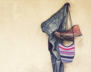 Vintage,Jeans,Leather shoes and bag hanging on the wall