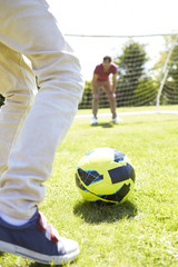 Father And Son Playing Football Together