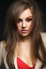 Fototapeta premium Portrait of a sexy red-hair woman with bright make up