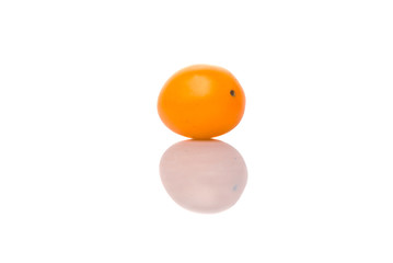 Yellow orange grape tomato over white background