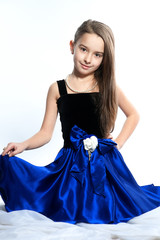  She is wearing an amazing dress with dark- bl. The little princess.