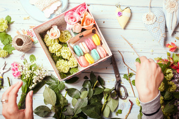 Box with flowers and macaroons