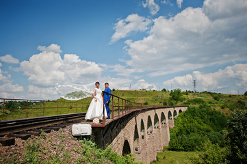 Obraz premium wedding couple at the railways