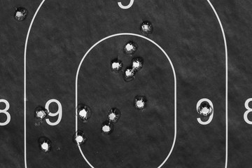Paper target in successful bullet holes