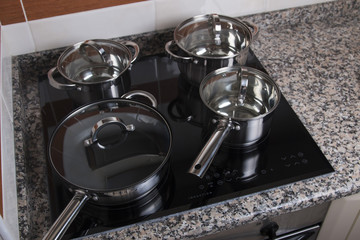 Close up view of an electrical kitchen induction ceramic hob.