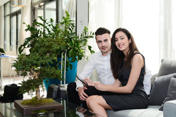 two business people man and woman waiting in  airport vip lounge