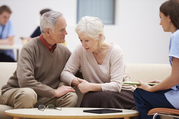 Senior Couple Discussing Test Results With Nurse