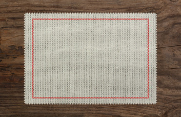 cloth table edge fabric torn, red stich cross border
