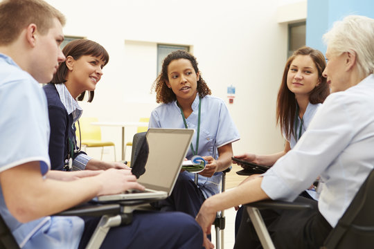 Members Of Medical Staff In Meeting Together