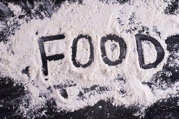 The word "food" written in flour  