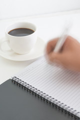 Coffee cup note book and pencil with Hand Writhing