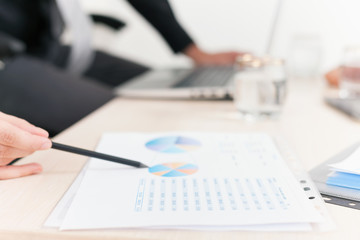 close-up graph and charts on table during business meeting