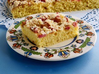 tasty fruit cake with rhubarb and crumble