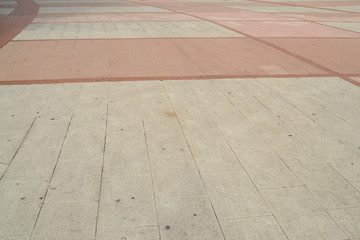 white and pink pavement, curved lines