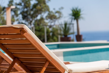 Luxury swimming pool and deck chair